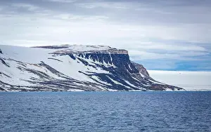Uria Lomvi Prints: rocks waterfall small iceberg and glacier at the Alkefjellet between Spitsbergen and Nordaustlandet on Svalbard