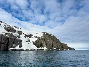 Uria Lomvi Prints: rocks waterfall small iceberg and glacier at the Alkefjellet between Spitsbergen and Nordaustlandet on Svalbard