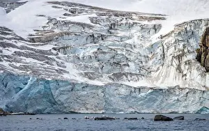 Uria Lomvi Prints: rocks waterfall small iceberg and glacier at the Alkefjellet between Spitsbergen and Nordaustlandet on Svalbard