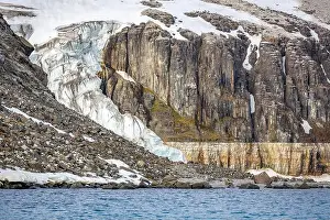 Uria Lomvi Prints: rocks waterfall small iceberg and glacier at the Alkefjellet between Spitsbergen and Nordaustlandet on Svalbard