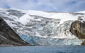 Uria Lomvi Prints: rocks waterfall small iceberg and glacier at the Alkefjellet between Spitsbergen and Nordaustlandet on Svalbard