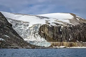 Uria Lomvi Prints: rocks waterfall small iceberg and glacier at the Alkefjellet between Spitsbergen and Nordaustlandet on Svalbard