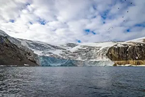 Uria Lomvi Prints: rocks waterfall small iceberg and glacier at the Alkefjellet between Spitsbergen and Nordaustlandet on Svalbard