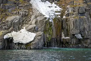 Uria Lomvi Prints: rocks waterfall small iceberg and glacier at the Alkefjellet between Spitsbergen and Nordaustlandet on Svalbard