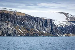 Uria Lomvi Prints: rocks waterfall small iceberg and glacier at the Alkefjellet between Spitsbergen and Nordaustlandet on Svalbard