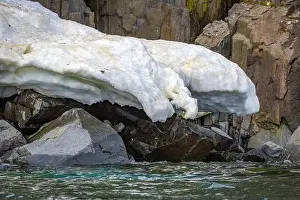 Uria Lomvi Prints: rocks waterfall small iceberg and glacier at the Alkefjellet between Spitsbergen and Nordaustlandet on Svalbard