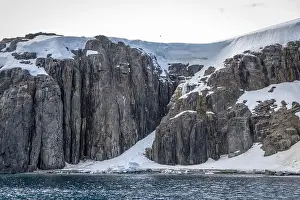 Uria Lomvi Prints: rocks waterfall small iceberg and glacier at the Alkefjellet between Spitsbergen and Nordaustlandet on Svalbard