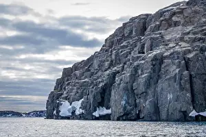 Uria Lomvi Prints: rocks waterfall small icebergs at the Alkefjellet between Spitsbergen and Nordaustlandet on Svalbard