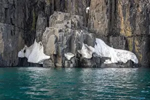 Uria Lomvi Prints: rocks waterfall small icebergs at the Alkefjellet between Spitsbergen and Nordaustlandet on Svalbard