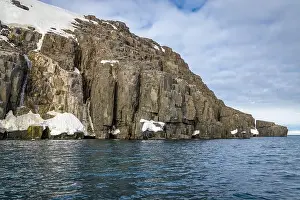 Uria Lomvi Prints: rocks waterfall small icebergs at the Alkefjellet between Spitsbergen and Nordaustlandet on Svalbard
