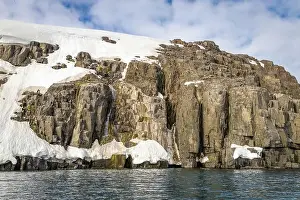 Uria Lomvi Prints: rocks waterfall small icebergs at the Alkefjellet between Spitsbergen and Nordaustlandet on Svalbard