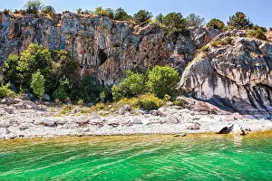 Caves Prints: The rocky shoreline of Megali Prespa Lake in Greece
