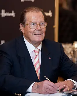 Harrods Prints: roger moore, actor, signs copies of his new book bond on bond at harrods store in knightsbridge