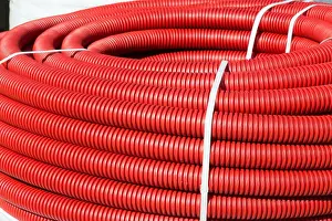Flexible Prints: roll of red Flexible Plastic Pipes