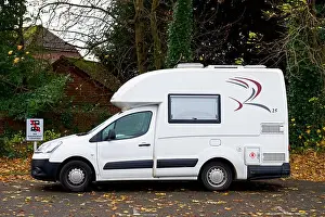 Romahome 25, a small camper van, park next to a sign - no motorhomes - England uk