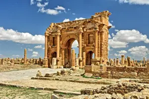 Algeria Prints: Roman arch construction at the gates of the Roman city of Timgad, Algeria