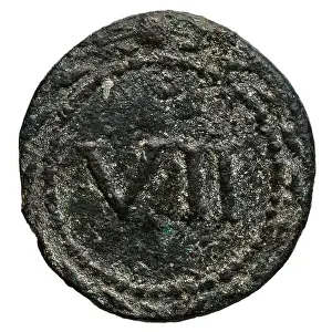 A Roman mythological tessera, a small token or coin, created by an ancient Roman mint workshop, dated to 27