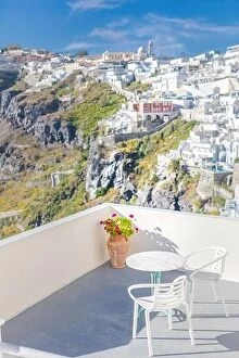 Images Dated 9th May 2019: Romantic two chairs and a table on the terrace, Santorini island Greece
