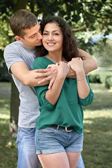 Sweetheart Prints: Romantic couple posing in city park, summer season, lovers boy and girl