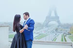 romantic moment near Eiffel tower, portrait of couple in love