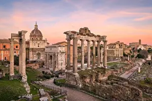 Rome, Italy at the historic Roman Forum ruins at dusk