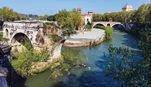 Rome, Italy. Isola Tiberina or Tiber Island seen from Ponte Paletino The ruined single span is of the so-called Ponte
