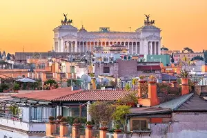 Rome, Italy rooftop cityscape at dusk with Victor Emmanuel II Monument