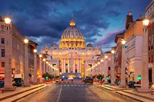 Rome, Vatican City. Cityscape image of illuminated Saint Peter`s Basilica and Street Via della Conciliazione, Vatican City, Rome, Italy
