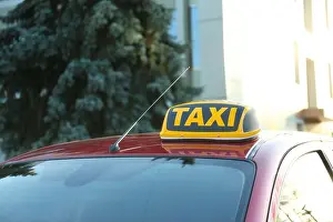 Roof light with word TAXI on car outdoors