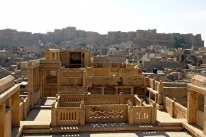 Jaisalmer Prints: rooftop view of traditional indian haveli or merchants house with the old town of jaisalmer in the distance