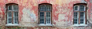 Design Pattern Prints: Three rotten curved windows in the red wall of a ruined old brick house