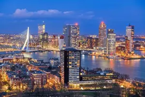 Rotterdam, Netherlands, city skyline over the Nieuwe Maas River at twilight