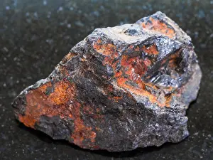 Admission Prints: rough Wolframite stone (tungsten ore) on dark