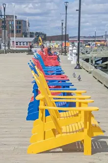 Adirondack Prints: Row of colorful Adirondack chairs at the waterfront boardwalk in Halifax
