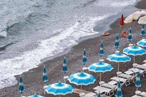 Holiday Resort Prints: Rows of blue and white parasols and sunbeds on the beach at Atrani on the Amalfi Coast