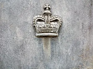 Embossed Prints: A Royal Crown motif cast in lead on the side of a lead planter