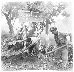 Repairing Prints: Two Royal Engineers repair a road in North Africa