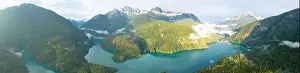 Rugged, forest-covered landscape surrounds Diablo Lake in North Cascades National Park. This mountainous region in Washington is absolutely beautiful