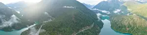 Rugged, forest-covered landscape surrounds Diablo Lake in North Cascades National Park. This mountainous region in Washington is absolutely beautiful