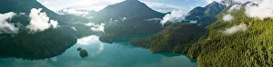 Rugged, forest-covered landscape surrounds Diablo Lake in North Cascades National Park. This mountainous region in Washington is absolutely beautiful