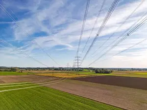 Energy Crisis Prints: Rural nature landscape in conflict with artificial structures of power poles