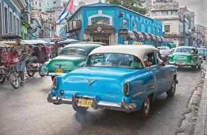 Havana Prints: Rush hour traffic in the heart of Havana showing taxis