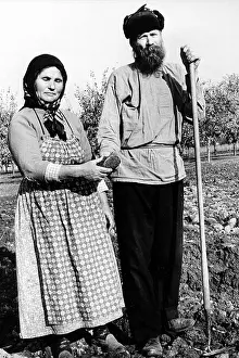 Wife Prints: Russian farmer and wife in field with hoe