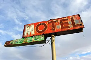 Green River Prints: Rusted and broken Motel sign, against sky, Green River, Utah, USA