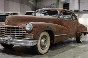 Drive Prints: Rusty Cadillac Fastback Coupe 62 series Sedanette Produced in 1946.