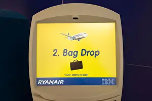 Suitcase Prints: Ryanair self service check in terminal at an airport, bag drop