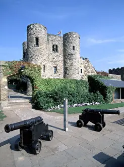 Historic Buildings Prints: Rye castle museum known as Ypres Tower a Grade I Historic listed building two old historical canon guns sunny blue sky