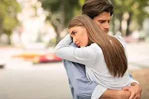 Free Space Prints: Sad Guy And Girl Hugging Feeling Unloved Standing Outdoors