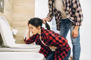 Hangover Prints: Sad woman throwing up in the toilet, hangover
