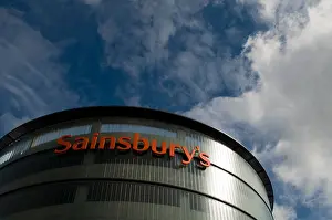 Chain Store Prints: Sainsbury's supermarket sign on a modern contemporary glass and steel building in High Wycombe town centre Bucks UK